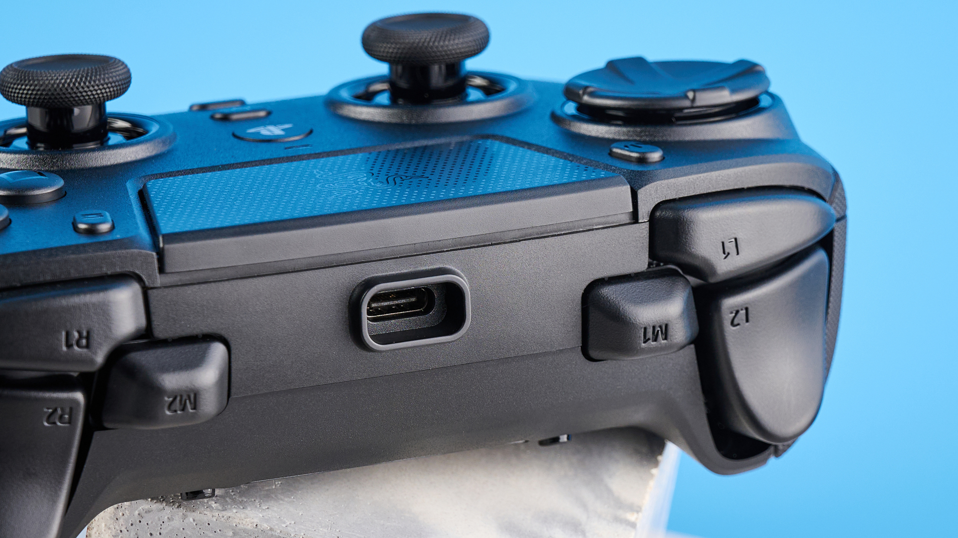 A black Razer Raiju V3 Pro controller for PS5