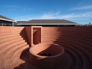 terracota coloured circles inside Neri&Hu Project_Qujiang Museum of Fine Arts Extension