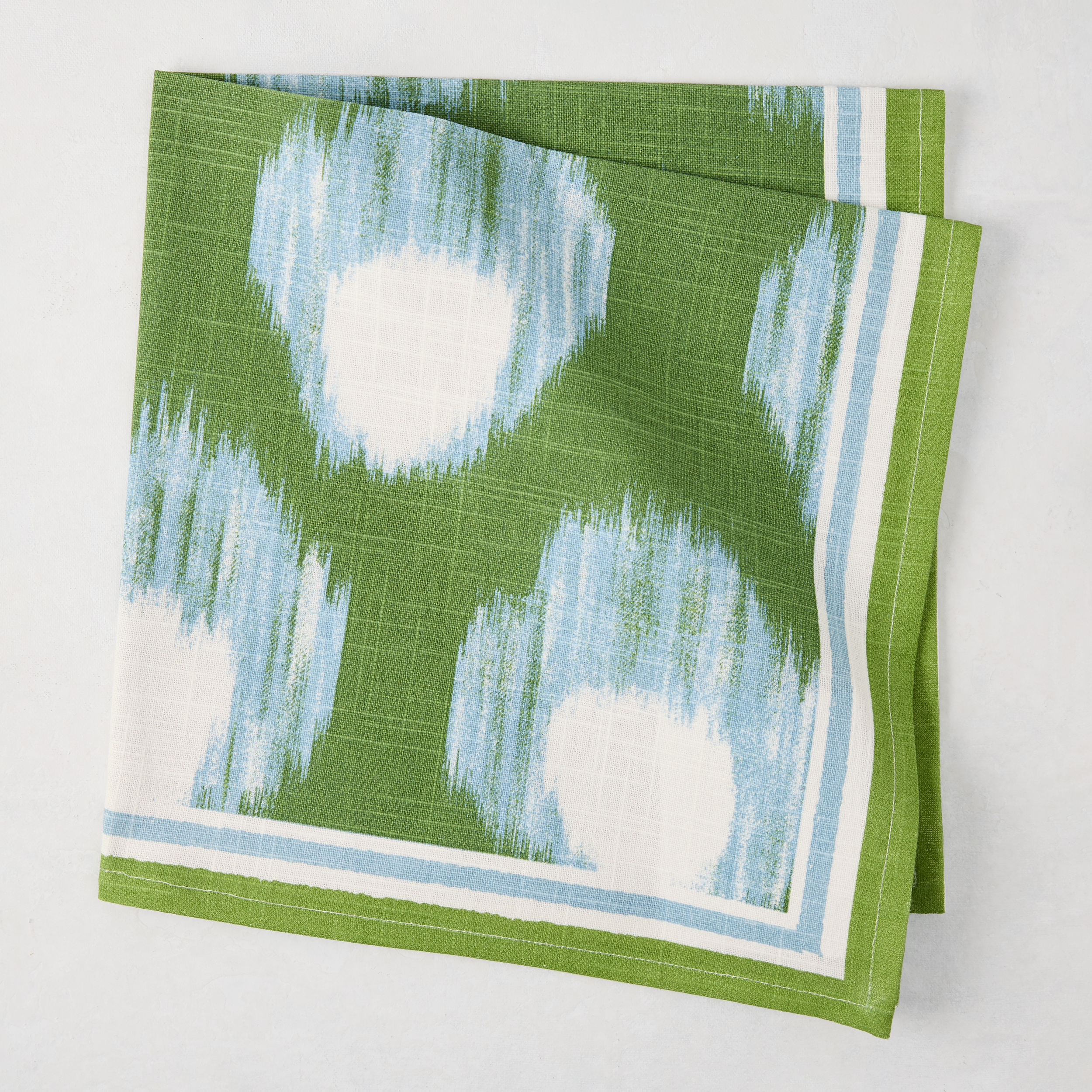 Green white and blue napkin on white backgroud