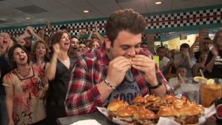 Adam Richman digging into The Ultimate Slider challenge