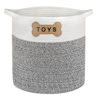 A grey and white toy storage basket with bone decal