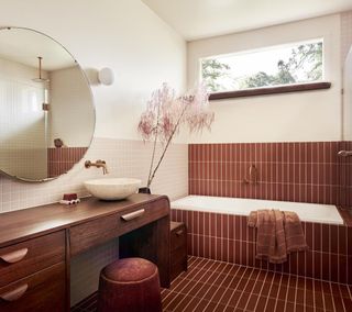 A tiled bathroom with accessories