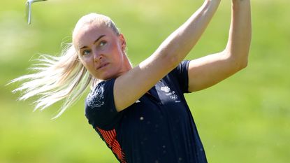 Charley Hull takes a shot during a practice round before the Olympics golf tournament