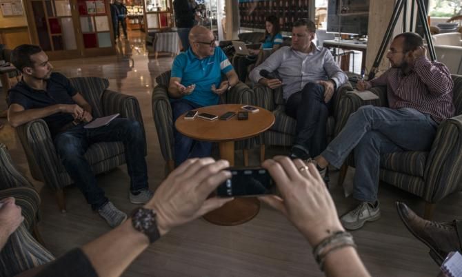 Dave Brailsford holds court with the the cycling media