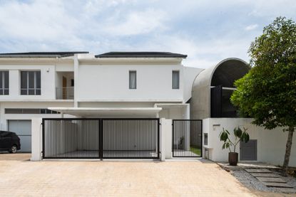 traditional house with quirky concrete barrel vaulted extension at Bewboc house in Malaysia by Fabian Tan Architect