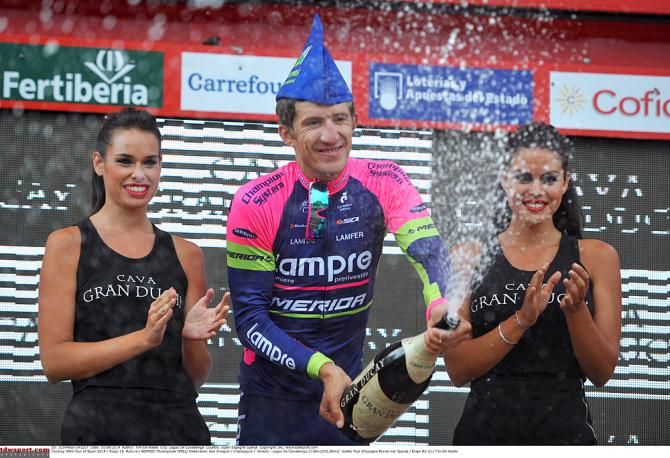 Przemyslaw Niemiec (Lampre-Merida) celebrates with a bottle of champagne