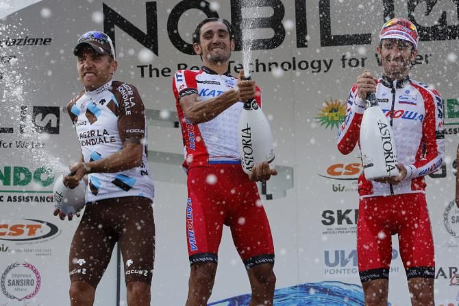 Giampaolo Caruso celebrates on the podium at Milano-Torino