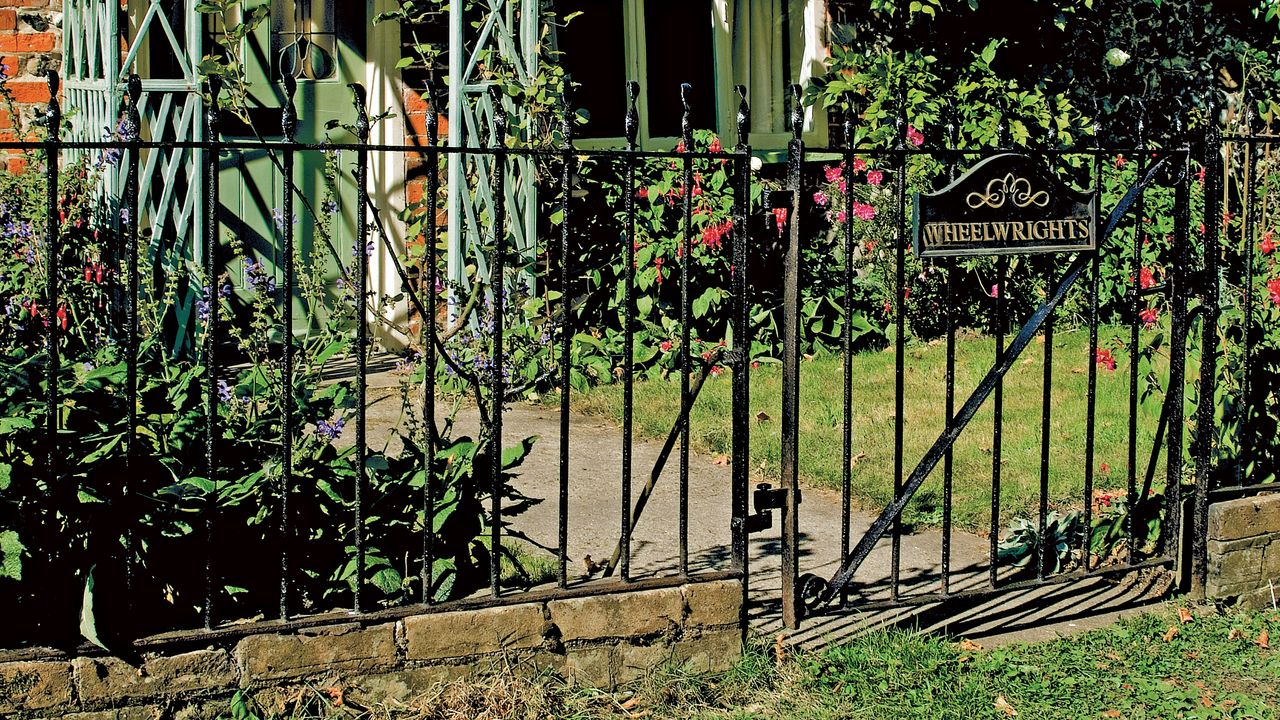 Restored and repainted original cast iron railings and gate