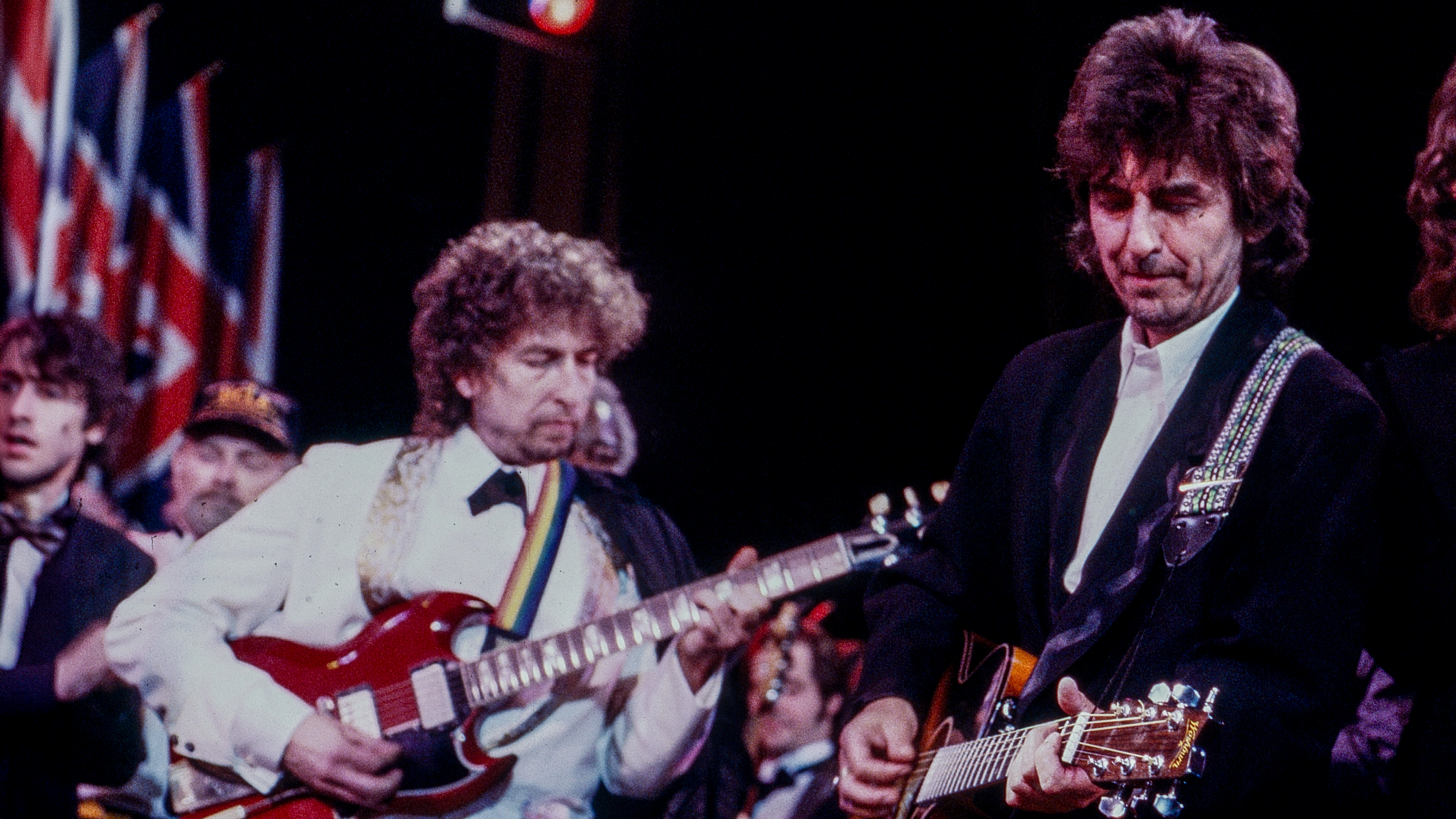 Bob Dylan, George Harrison and Mick Jagger perform at the Rock and Roll Hall of Fame Induction Ceremony in New York City on January 20, 1988.