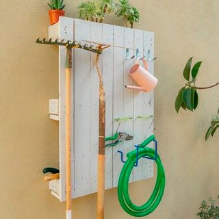 gardening tools with a pair of scissor water sprayer and wall hooks