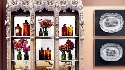 Glass cabinet and pink paint in The Orangery by Firmdale Hotels, designed by Kit Kemp
