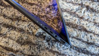 Asus Zenbook 14X OLED laptop on carpet