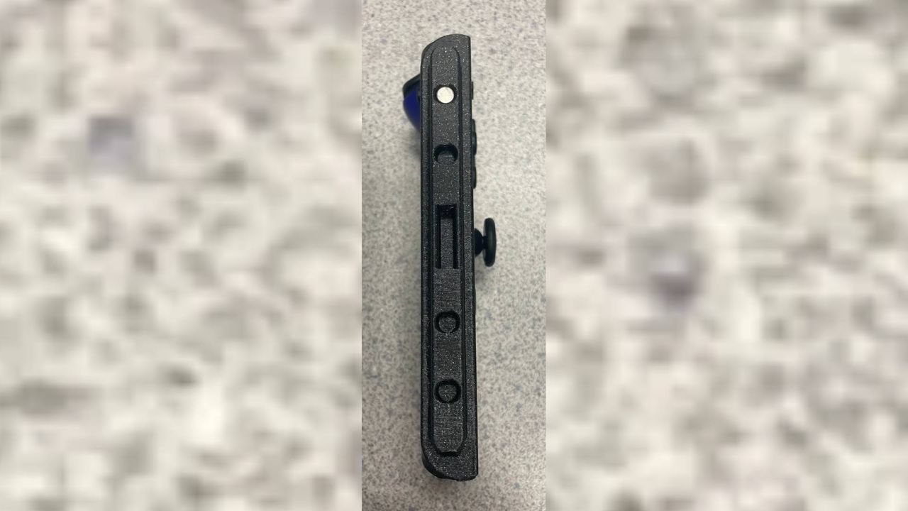 3D Printed Switch 2 to Joy-Con adapter with magnet connector facing forward.