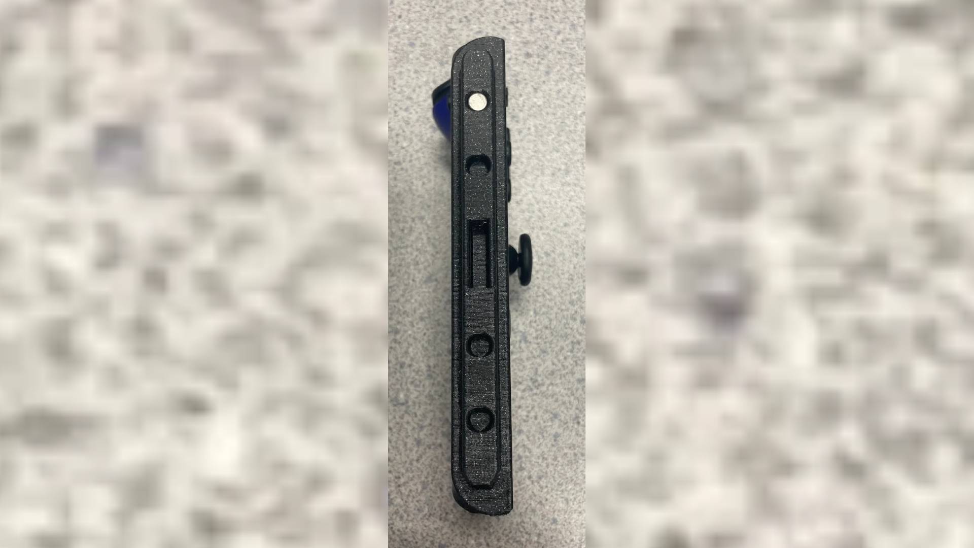 3D Printed Switch 2 to Joy-Con adapter with magnet connector facing forward.