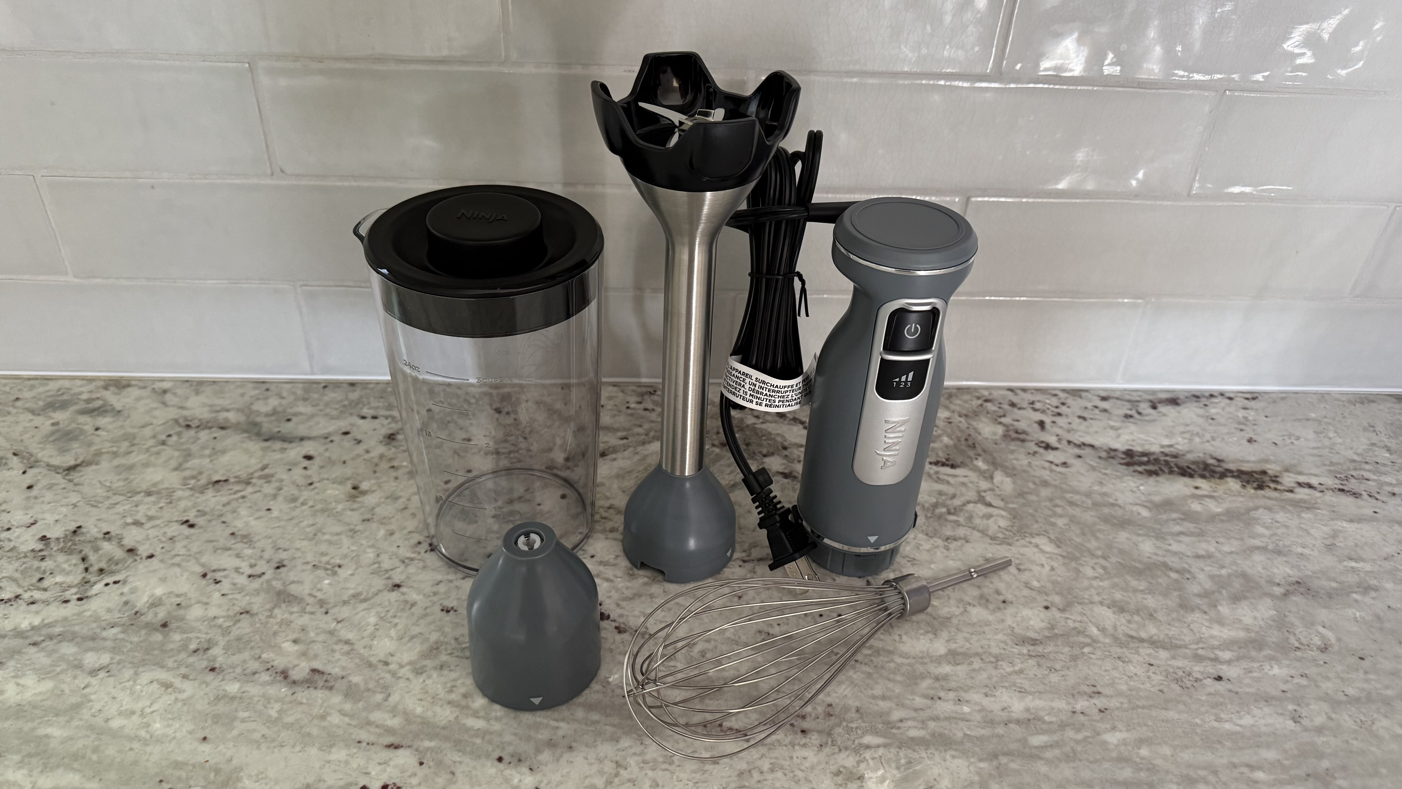 Ninja Power Duo Immersion Blender with Whisk parts on counter