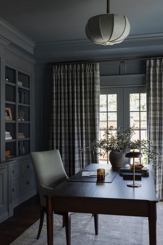 study with grey blue walls and tartan check curtains