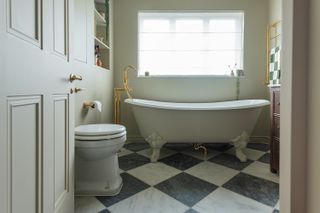 Green bathroom in Farrow & Ball Bone with checkered floor