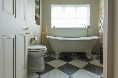 Green bathroom in Farrow & Ball Bone with checkered floor
