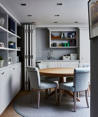 Grey dining room with small round table