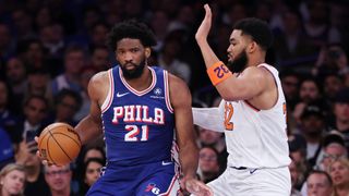 Joel Embiid of the Philadelphia 76ers works against Karl-Anthony Towns of the New York Knicks during the 2026 NBA Playoffs