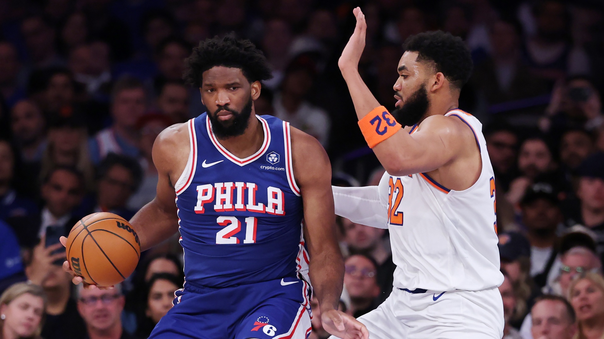 Joel Embiid of the Philadelphia 76ers works against Karl-Anthony Towns of the New York Knicks during the 2026 NBA Playoffs