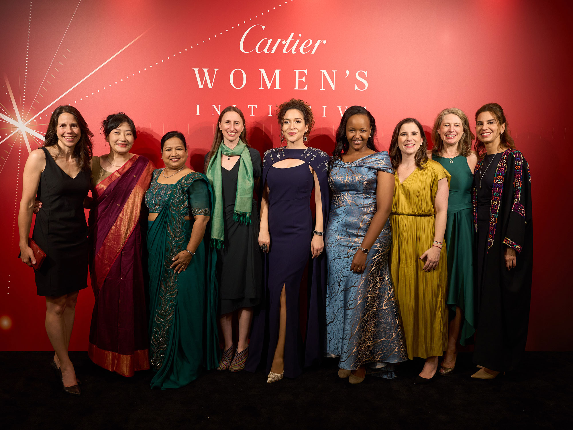 a group of women pose for the camera