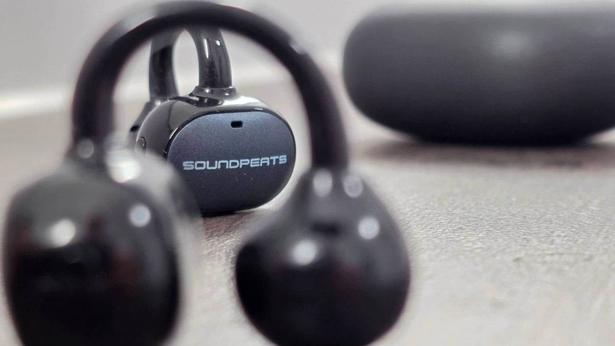 The Soundpeats Pop Clip2 on a wooden table.