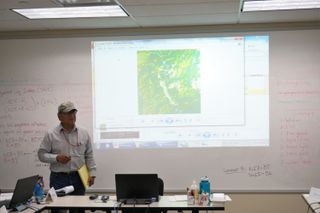 A participant presents their final remote sensing project to the training group during the Introduction to Remote Sensing course taught by NASA's Indigenous Peoples Capacity Building Initiative and hosted by the Bureau of Indian Affairs at their offices in Denver.