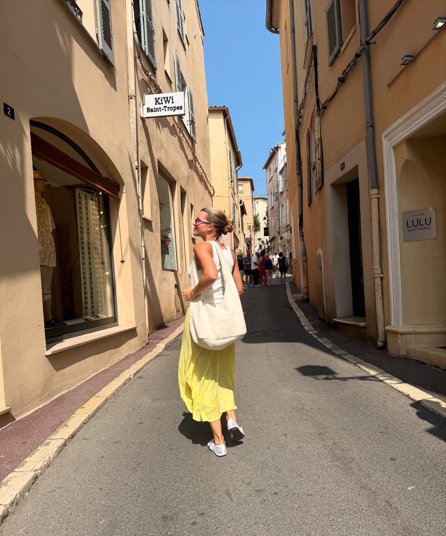 Sofia Richie wearing a yellow slip skirt in Saint-Tropez