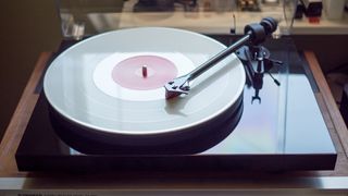 Pro-Ject Debut Carbon on a wooden table