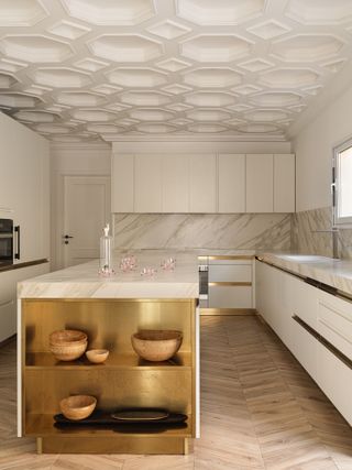 A kitchen with a coffered ceiling