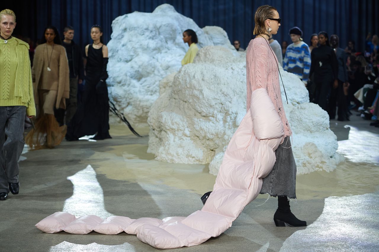 Woman on runway at Copenhagen Fashion Week A/W 2023 in outfit with puffer jacket train