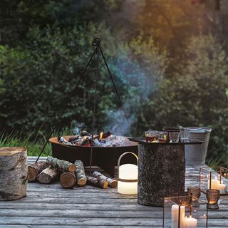 outdoor sitting with fire pit and candles