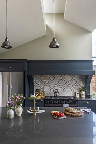 granite countertop in gray kitchen with white walls
