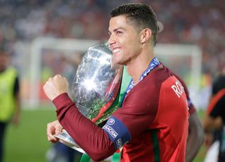 Cristiano Ronaldo of Portugal with the European Championship trophy, 2016