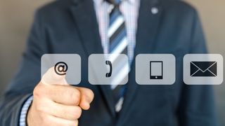 An image of a man in a suit choosing between different communications options.