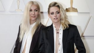 Dylan Meyer and Kristen Stewart arrive on the red carpet outside the Dolby Theater for the 94th Academy Awards in Los Angeles.
