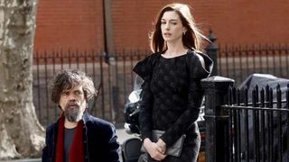 Peter Dinklage and Anne Hathaway as Composer Steven Lauddem and Patricia walking outside in She Came to Me
