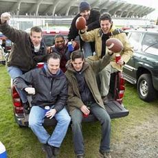 men tailgating at a football game