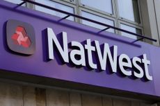 The NatWest logo above a high street branch (Photographer: Hollie Adams/Bloomberg via Getty Images)