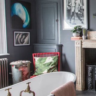 bathroom with photo frame and red chair