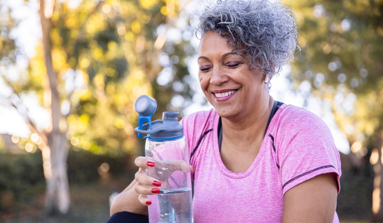 Person drinking from water bottle