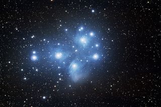 The Pleiades (M45) appear as a cluster of blue stars.