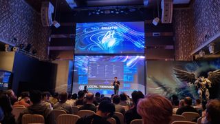 The Gigabyte Unleashed Computex 2024 event, with a speaker showing off AI Top software