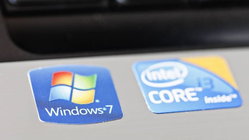Cape Town, South Africa - June 27, 2011: Stickers on a new laptop computer brag about its equipment: the Windows 7 operating system and the Intel Core i3 processor chip. Part of the keyboard can be seen, out of focus, in the background.