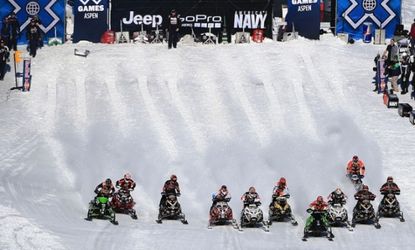 Racers leave the start in the Snowmobile Snocross at Winter X Games in Aspen, Colorado, Jan. 27