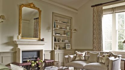 Neutral room, assorted sofas, alcove storage, sash window, gilded mirror