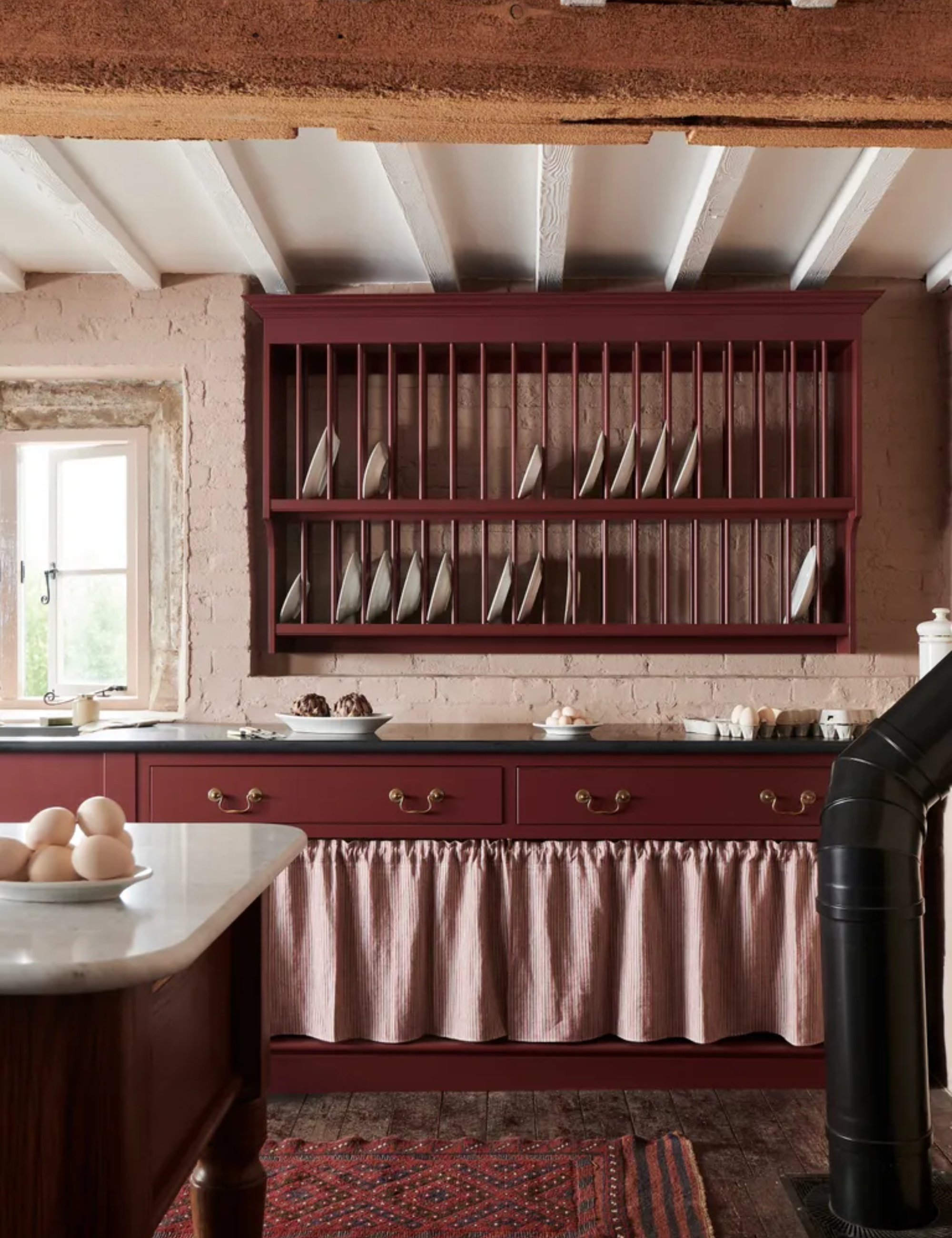 heirloom kitchen burgundy with painted cabinetry and plate rack