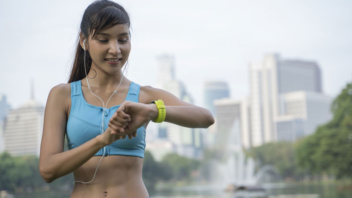 A woman checking her fitness tracker 