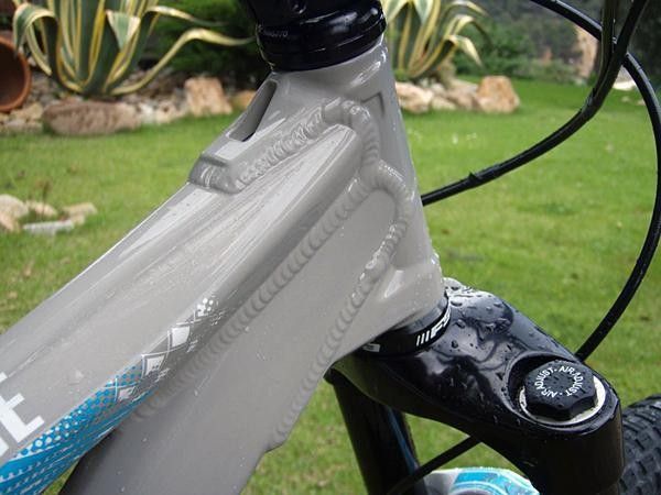 Those aren't gussets welded to the head tube; they're directly built-in for more strength than separate bits.